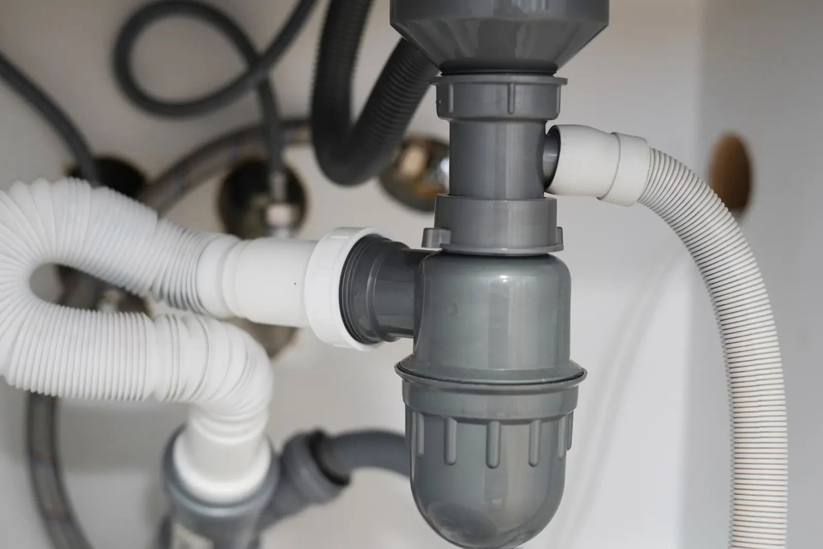 Under-sink waste pipe, bottle trap and flexible waste hoses, waste pipe repairs Reading