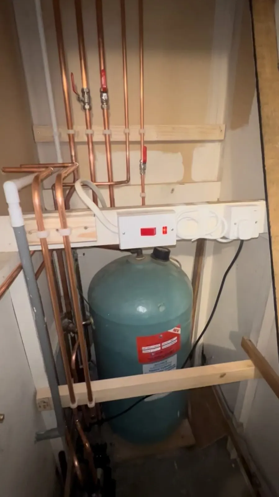 Vented hot water cylinder in airing cupboard with new copper pipework and isolation valves